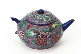 A SMALL ENAMELLED YIXING POTTERY TEAPOT