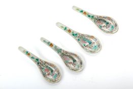 A SET OF FOUR FAMILLE ROSE 'PHOENIX' SPOONS