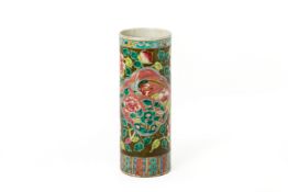 AN OLIVE GREEN GROUND FAMILLE ROSE JOSS STICK HOLDER