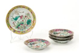 A GROUP OF FIVE WHITE GROUND FAMILLE ROSE SMALL PLATES