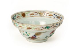 AN OGEE SHAPED WHITE GROUND FAMILLE ROSE PORCELAIN BOWL