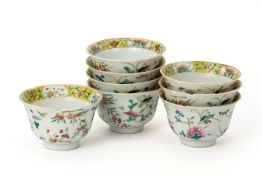 A SET OF EIGHT FAMILLE ROSE PORCELAIN TEA CUPS