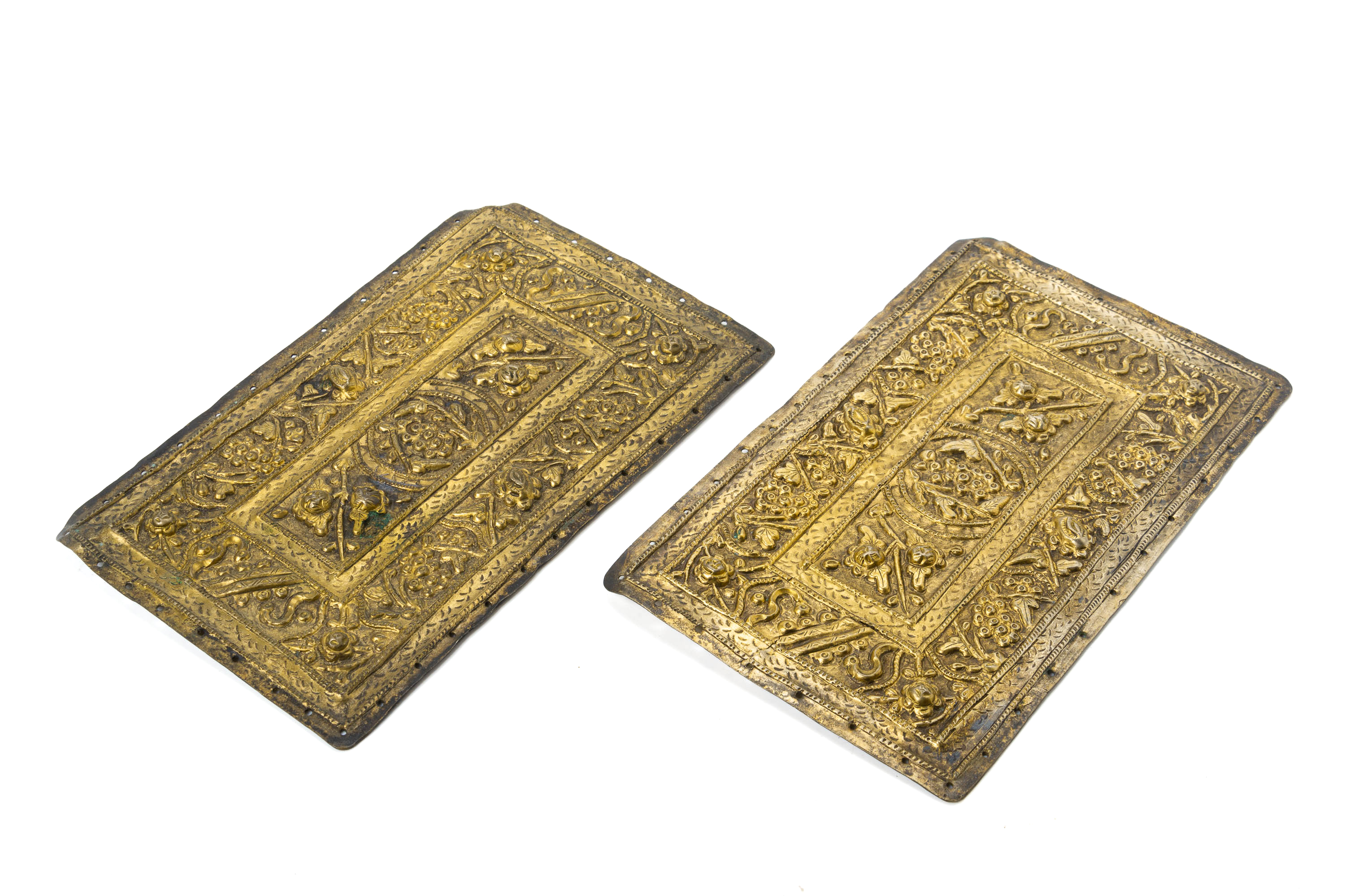 A SET OF THREE REPOUSSE SILVER GILT PILLOW ENDS - Image 3 of 4