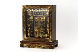 A CARVED AND PARCEL GILT ANCESTRAL SHRINE CABINET