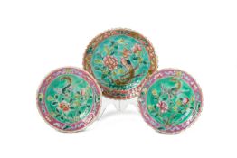 A GROUP OF TURQUOISE GROUND FAMILLE ROSE SAUCERS