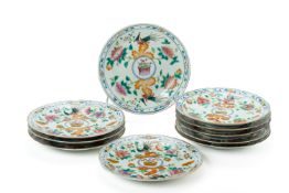 A SET OF TEN WHITE GROUND FAMILLE ROSE 'PHEASANT' PLATES