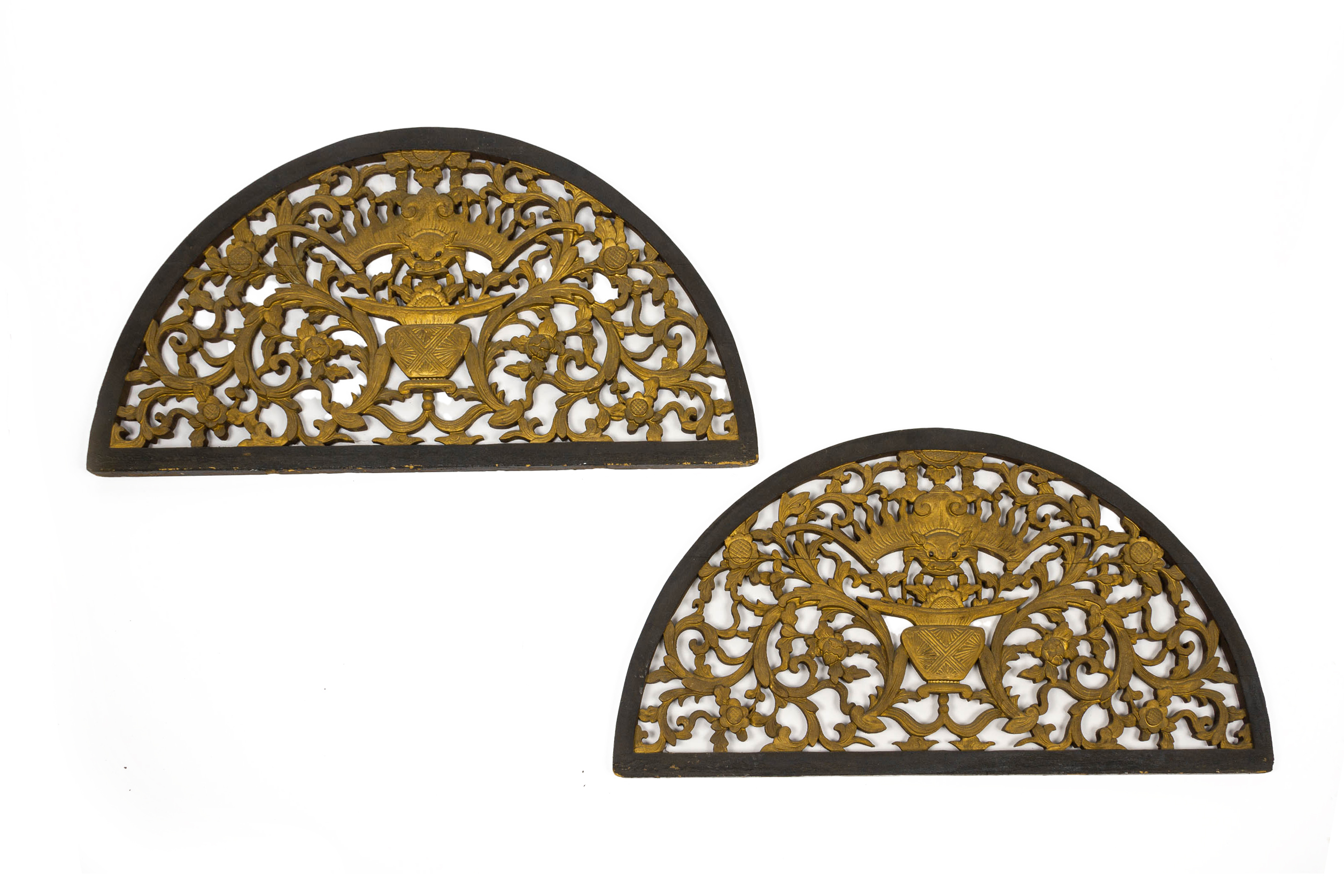 A PAIR OF ARCHED CARVED AND PIERCED WOOD PANELS