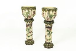 A PAIR OF GLAZED JARDINIERES ON STANDS