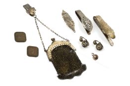A GROUP OF WHITE METAL ACCESSORIES
