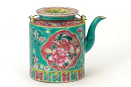 A TURQUOISE GROUND FAMILLE ROSE CYLINDRICAL TEAPOT