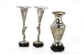 A PAIR OF SILVER PLATED TRUMPET VASES AND A BALUSTER VASE