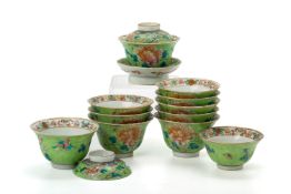 A GROUP OF LIME GREEN GROUND PORCELAIN TEA BOWLS