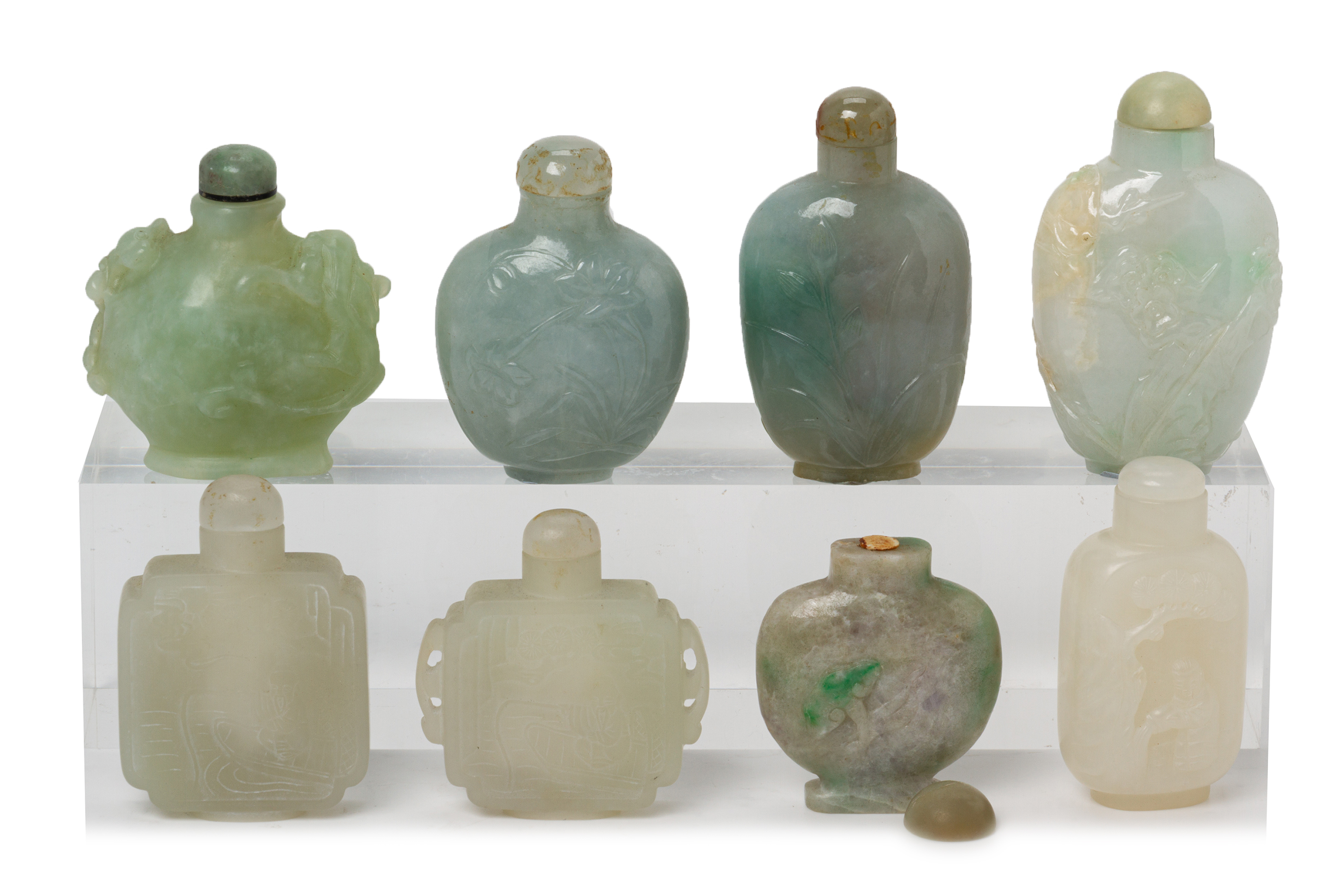 A GROUP OF EIGHT CARVED JADE SNUFF BOTTLES