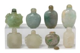 A GROUP OF EIGHT CARVED JADE SNUFF BOTTLES