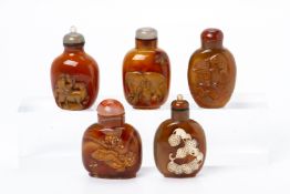 A GROUP OF FIVE CARVED AGATE SNUFF BOTTLES