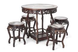 A MARBLE INSET CIRCULAR HARDWOOD TABLE AND FOUR STOOLS