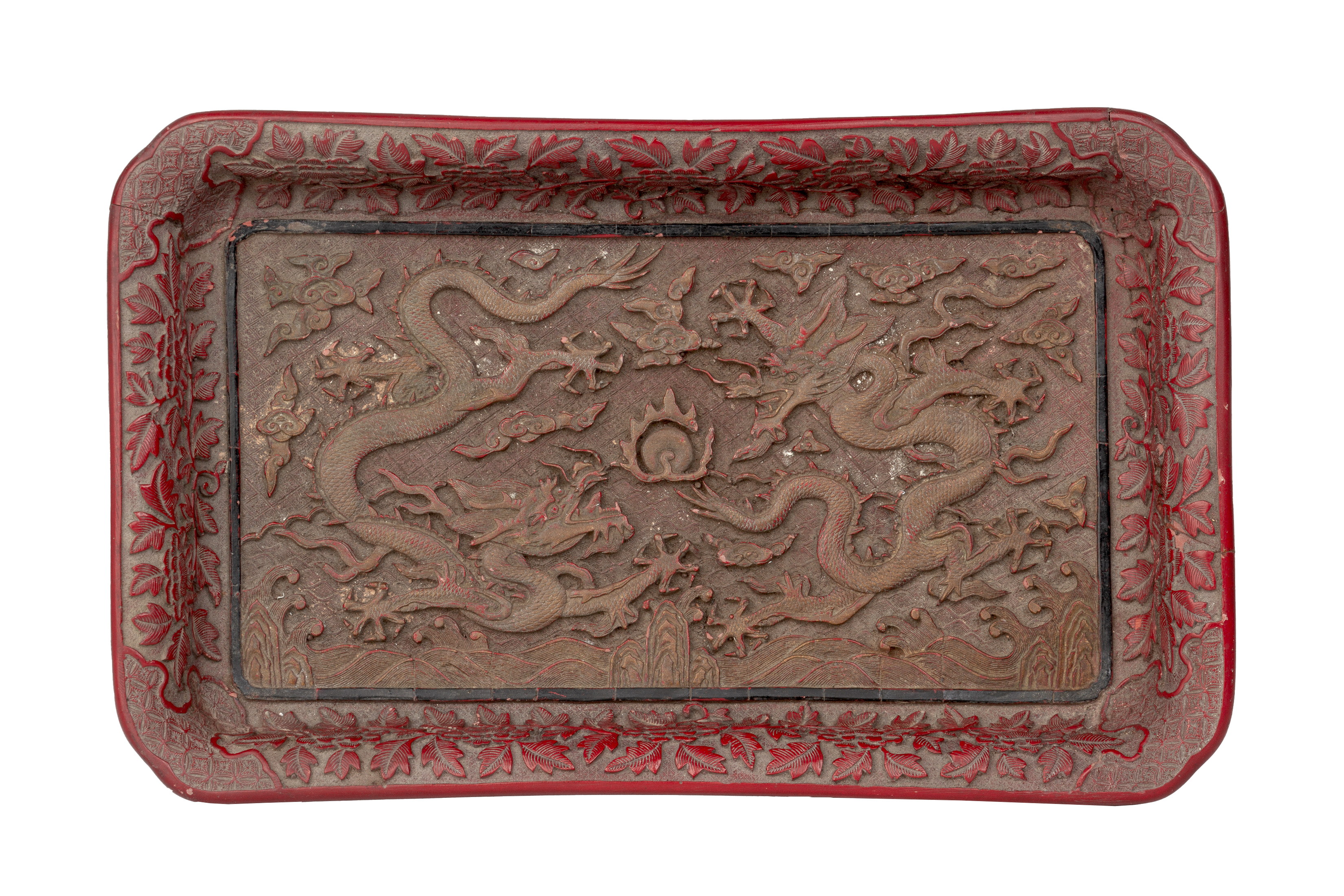 A CARVED CINNABAR LAQUER DRAGON TRAY