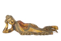 A SOUTHEAST ASIAN GILTWOOD CARVED RECUMBENT BUDDHA