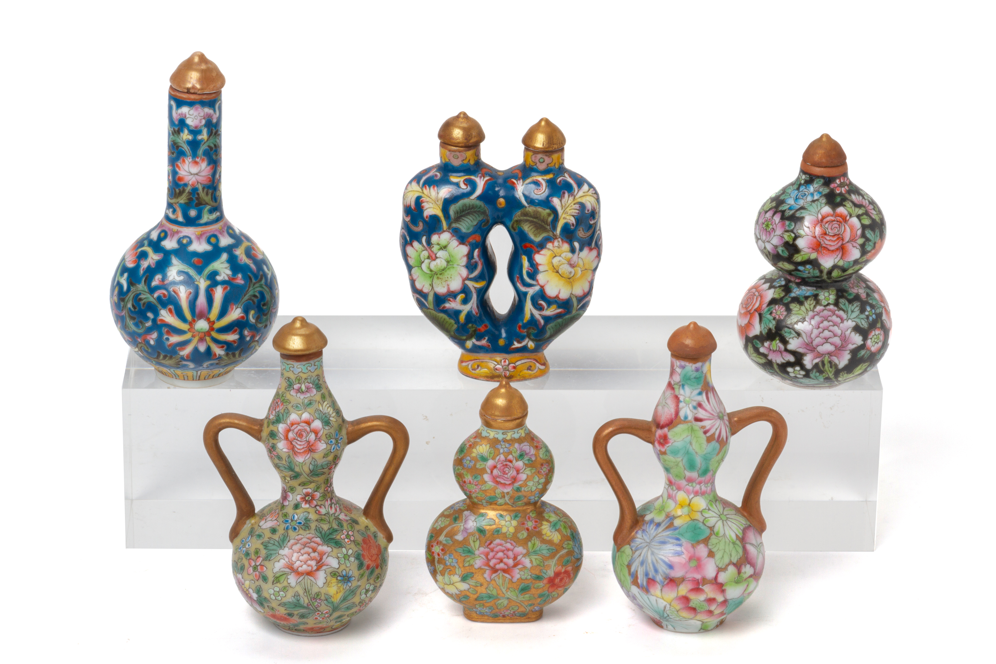 A GROUP OF SIX POLYCHROME ENAMELLED PORCELAIN SNUFF BOTTLES