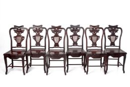A SET OF SIX MARBLE INSET BLACKWOOD SIDE CHAIRS