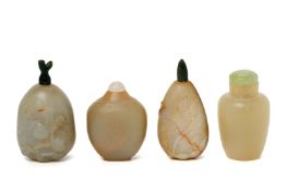 A GROUP OF FOUR CARVED JADE SNUFF BOTTLES