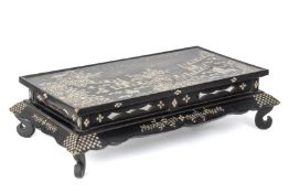 A MOTHER OF PEARL INLAID BLACK LACQUER KANG TABLE