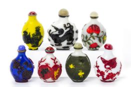 A GROUP OF SEVEN OVERLAID GLASS SNUFF BOTTLES