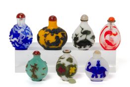 A GROUP OF SEVEN OVERLAID GLASS SNUFF BOTTLES