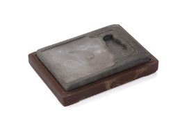 A CARVED RECTANGULAR INKSTONE WITH BOX