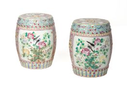 A PAIR OF PINK GROUND FAMILLE ROSE PORCELAIN STOOLS