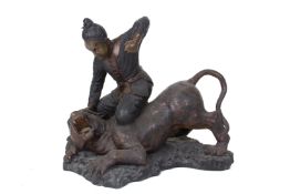 A LARGE BRONZE GROUP OF A CHINESE FIGURE FIGHTING A TIGER