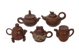 A GROUP OF FIVE YIXING POTTERY TEAPOTS