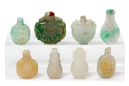 A GROUP OF EIGHT JADE AND HARDSTONE SNUFF BOTTLES