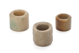 A GROUP OF THREE JADE ARCHERS RINGS