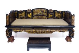 A CHINESE CARVED GILT AND BLACK LACQUERED DAY BED