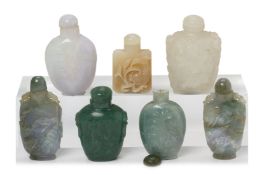 A GROUP OF SEVEN CARVED JADE SNUFF BOTTLES