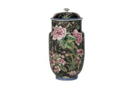A BLACK GROUND FAMILLE ROSE PORCELAIN JAR AND COVER