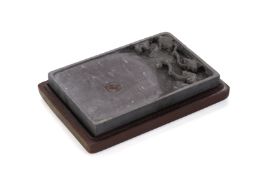 A CARVED RECTANGULAR INKSTONE WITH BOX