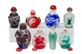 A GROUP OF EIGHT OVERLAID GLASS SNUFF BOTTLES