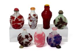 A GROUP OF SEVEN OVERLAID GLASS SNUFF BOTTLES