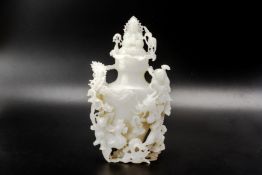 A CARVED JADE VASE AND COVER