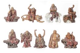 A SET OF SHIWAN POTTERY FIGURES OF THE EIGHTEEN LUOHANS