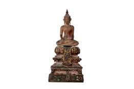 A SMALL SOUTHEAST ASIAN CARVED WOOD BUDDHA ON STAND