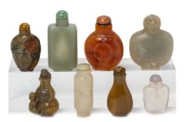 A GROUP OF EIGHT JADE AND HARDSTONE SNUFF BOTTLES