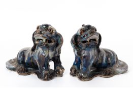 A PAIR OF SHIWAN POTTERY FOO DOGS