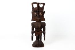 A SOUTHEAST ASIAN CARVED WOOD FIGURE