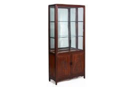 A ROSEWOOD GLAZED DISPLAY CABINET