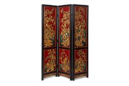 A GILT AND LACQUERED CARVED WOOD THREE FOLD SCREEN