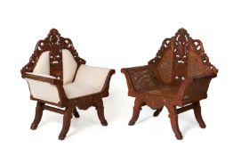 A PAIR OF CARVED WOOD ARMCHAIRS
