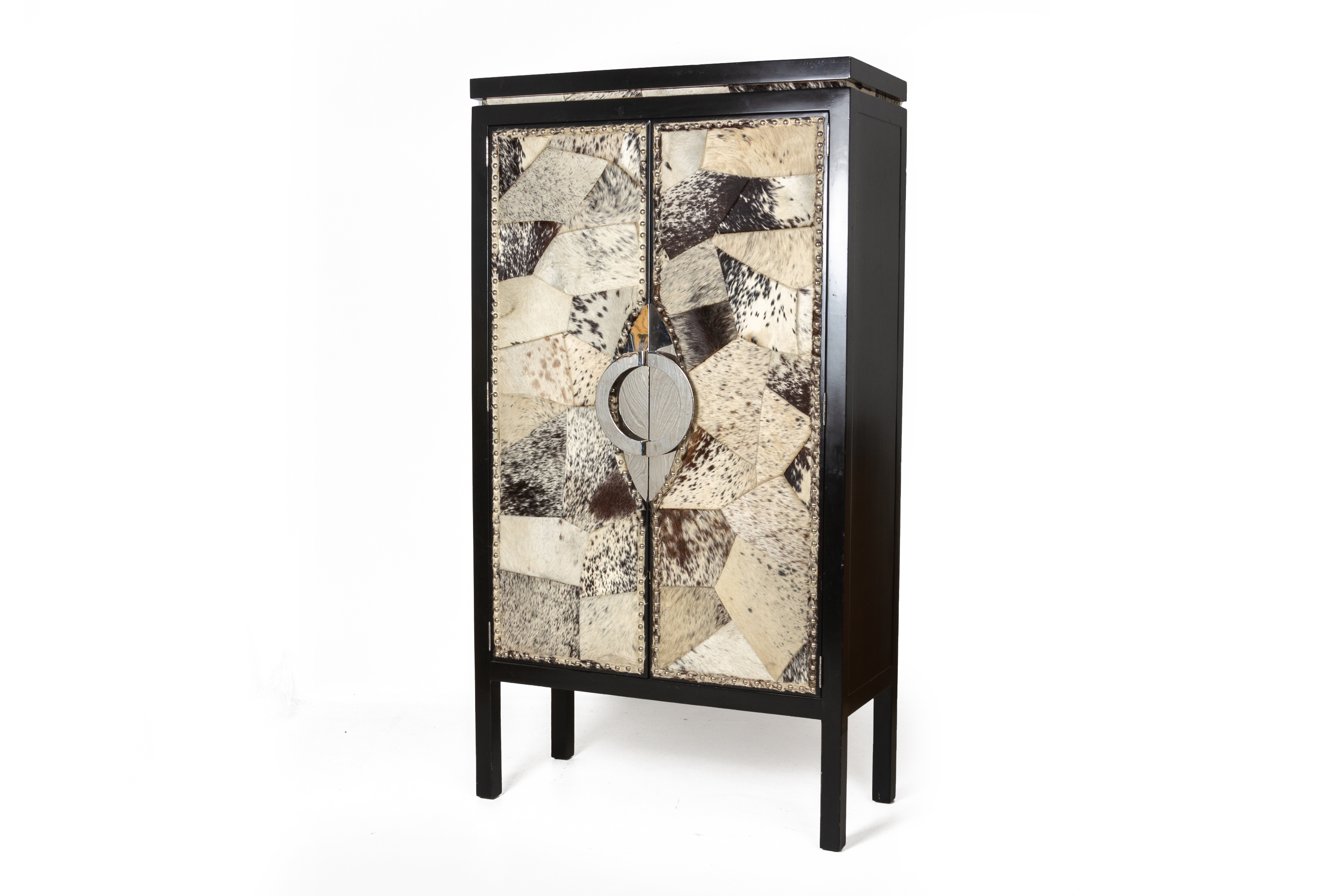 A LARGE 'SALT AND PEPPER' COWHIDE UPHOLSTERED CABINET